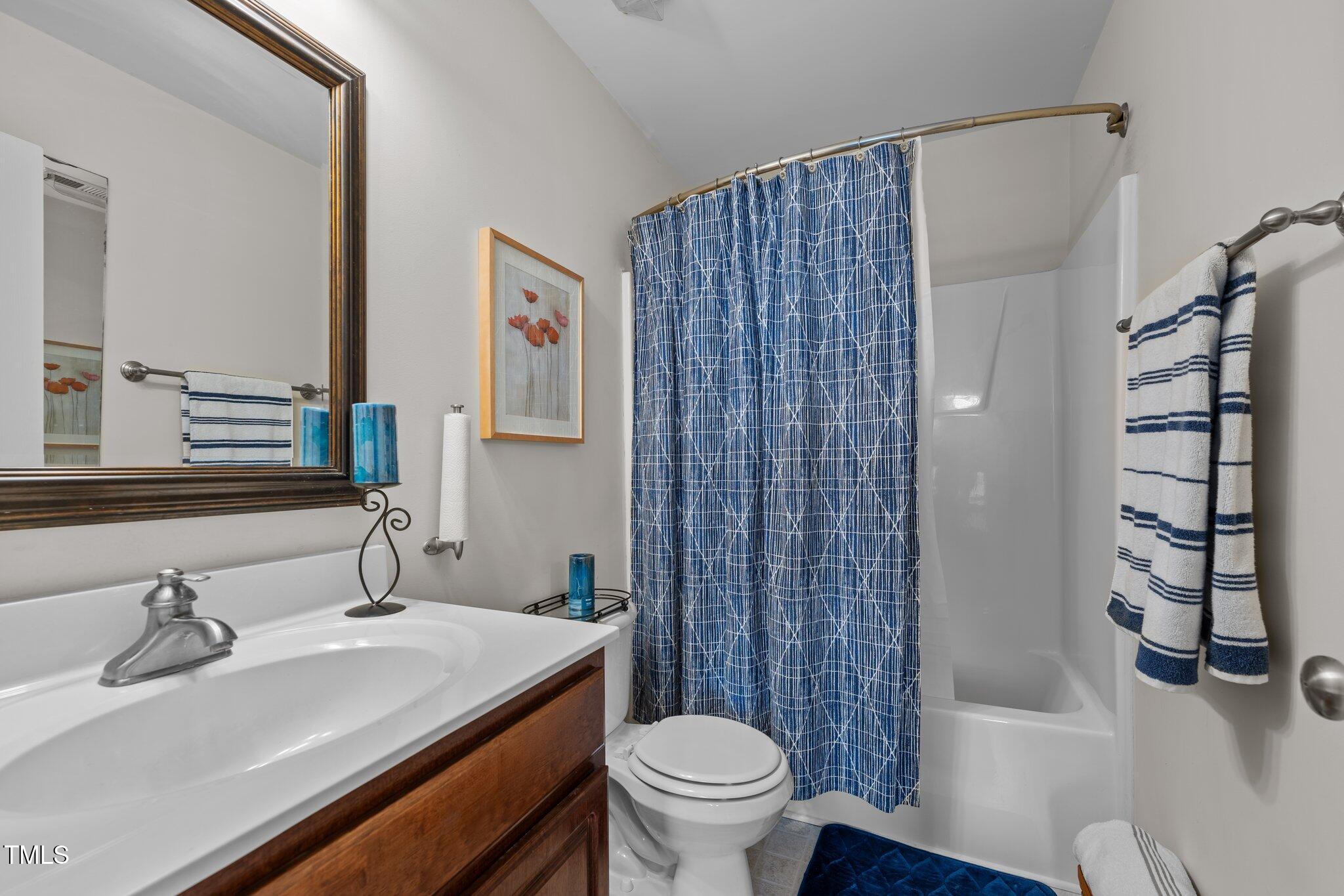 4027 Comrie Lane Burlington, NC 27215 - Photo 31 of 47 a bathroom with a sink toilet and shower