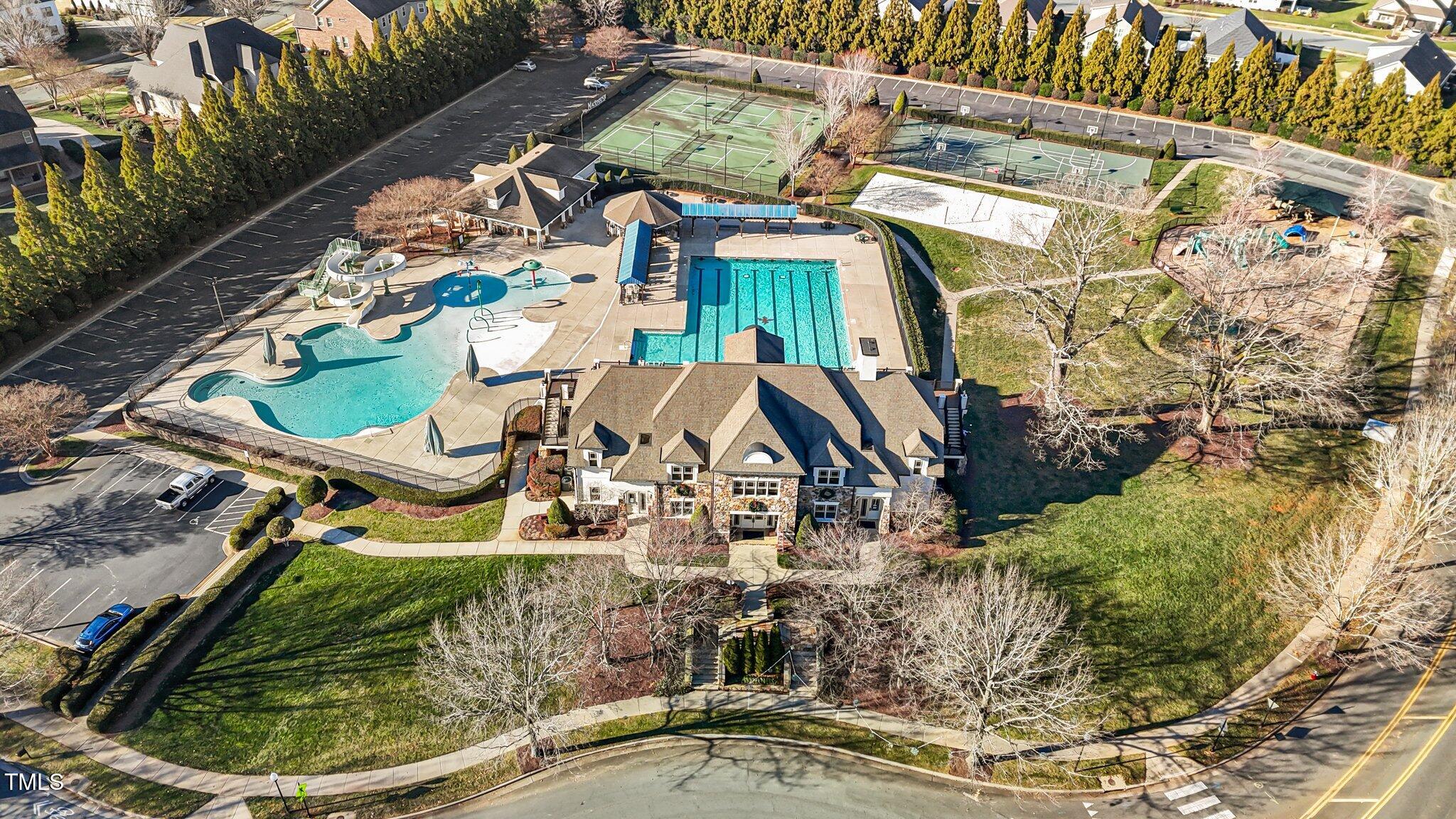 4027 Comrie Lane Burlington, NC 27215 - Photo 40 of 47 an aerial view of a house with a yard and potted plants