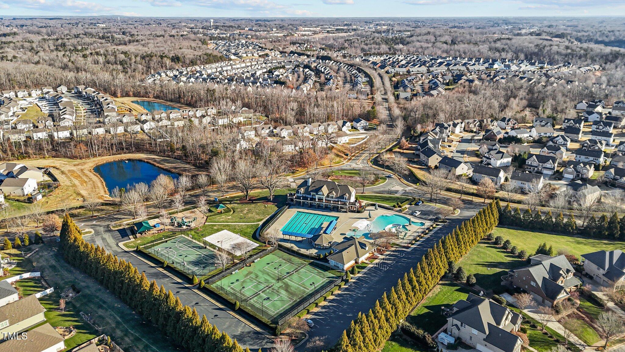 4027 Comrie Lane Burlington, NC 27215 - Photo 44 of 47 an aerial view of residential houses with outdoor space