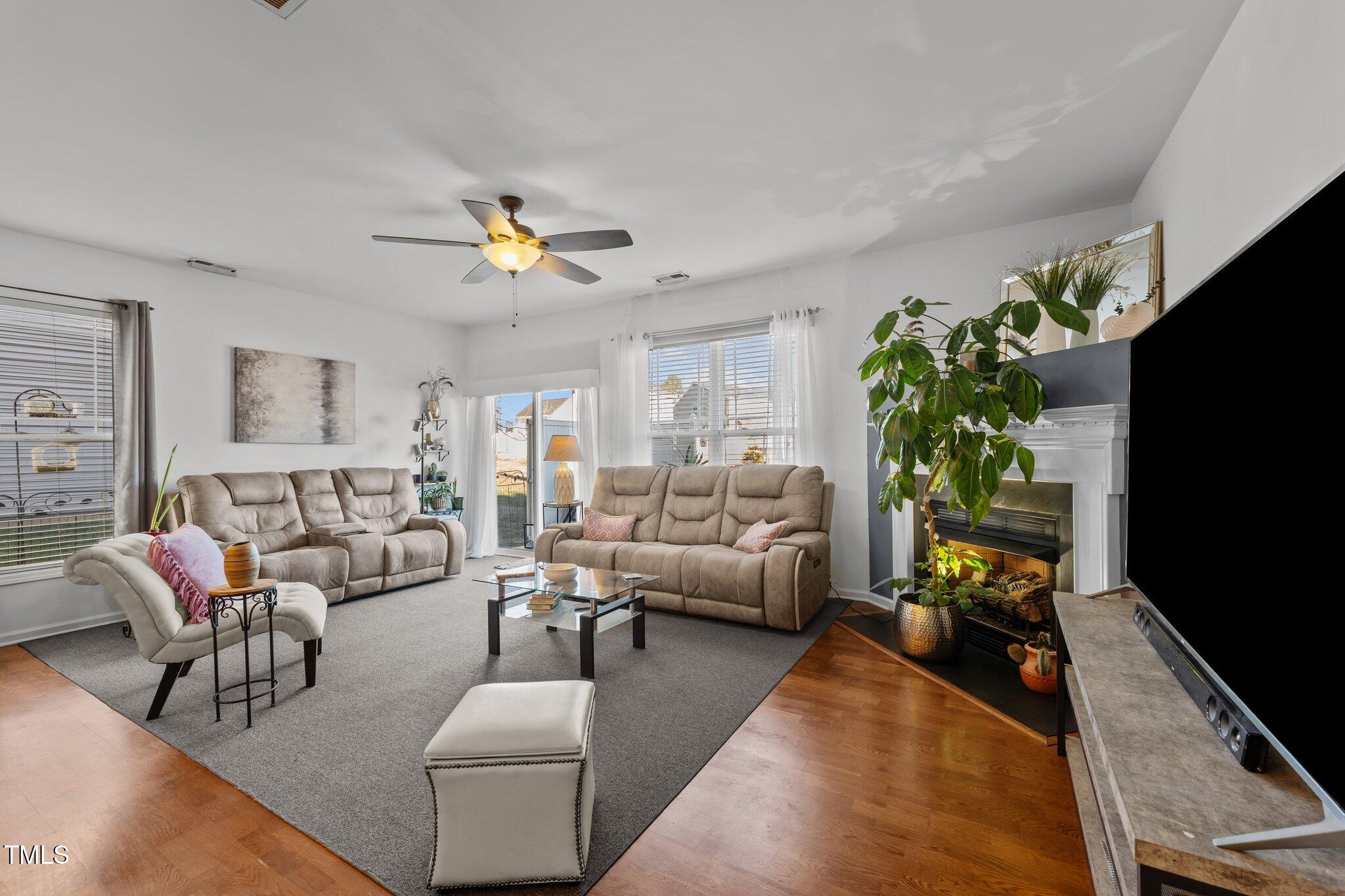 4027 Comrie Lane Burlington, NC 27215 - Photo 9 of 47 a living room with furniture potted plant and a window