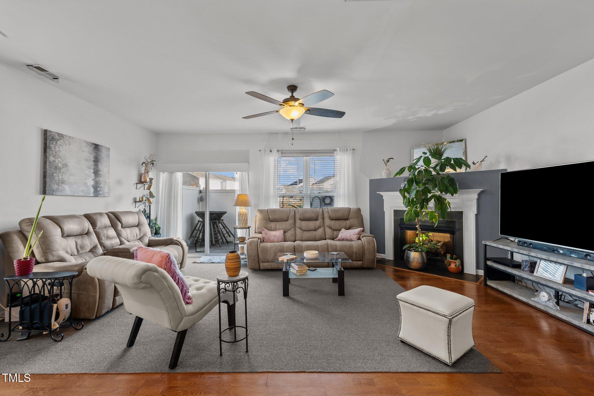 4027 Comrie Lane Burlington, NC 27215 - Photo 10 of 47 a living room with furniture and a flat screen tv