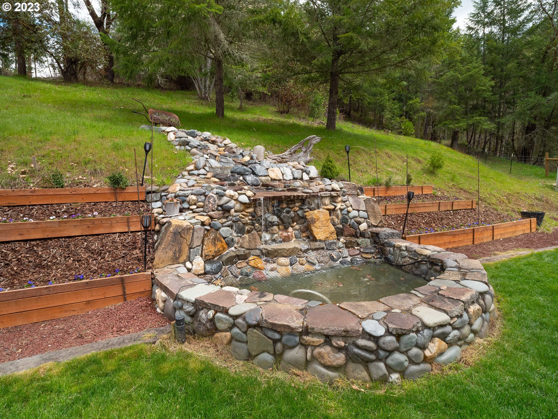 920 Rice Creek Road Winston, OR 97496 - Photo 8 of 41 a view of a backyard with sitting area