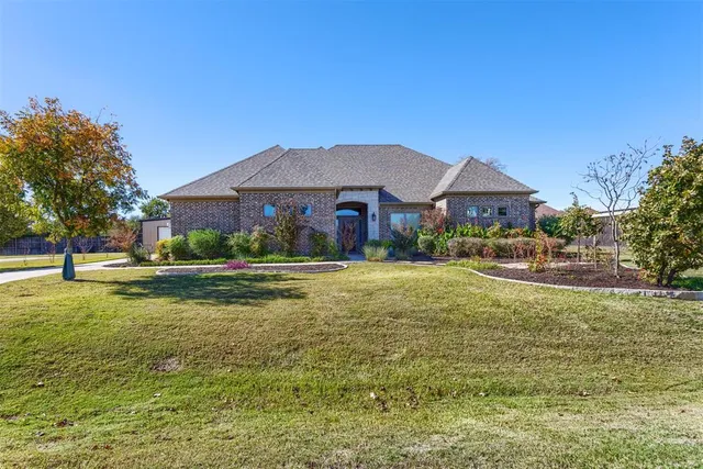 a swimming pool is sitting in front of a house
