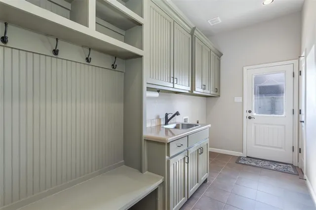 a kitchen with cabinets and window