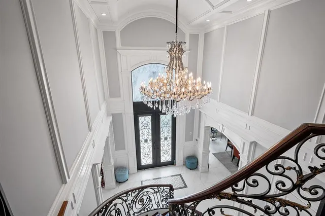 a bathroom with a granite countertop sink a toilet and a mirror