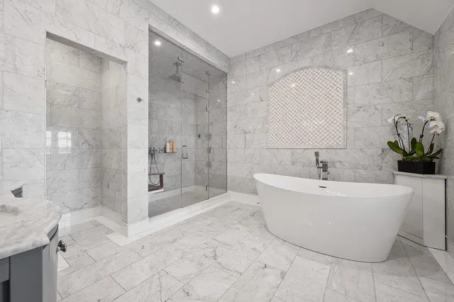 a utility room with dryer washer and a rug
