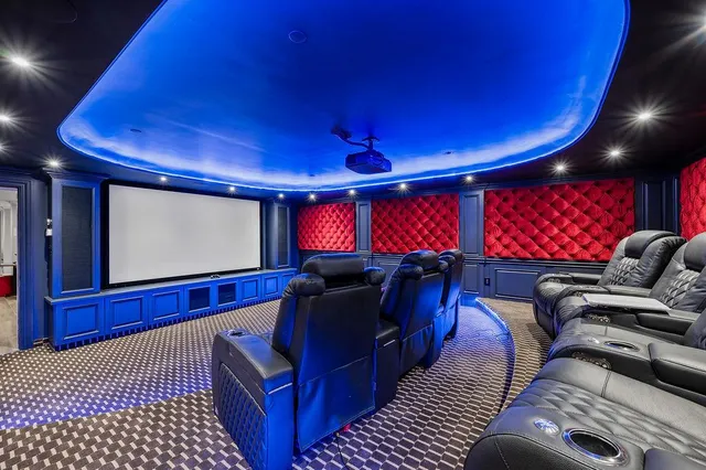 a view of a room with gym equipment and kitchen view