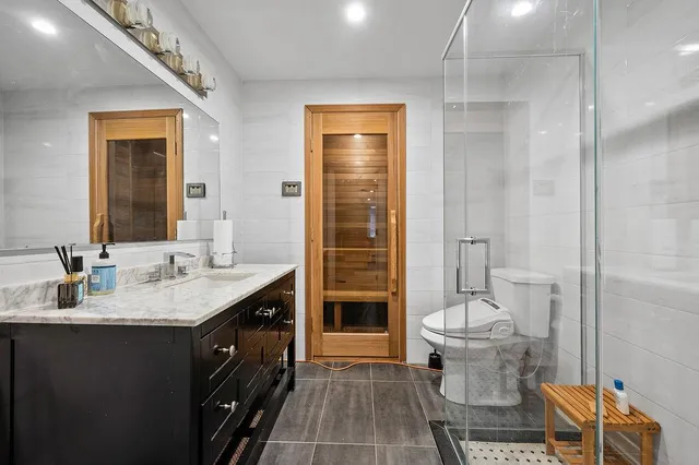 a bed room with a bed and glass door