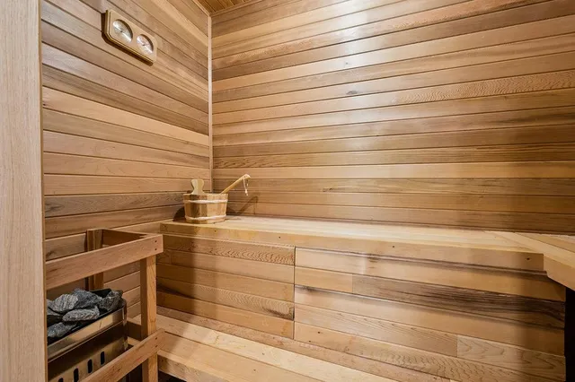 a view of a dining room with furniture large windows and wooden floor
