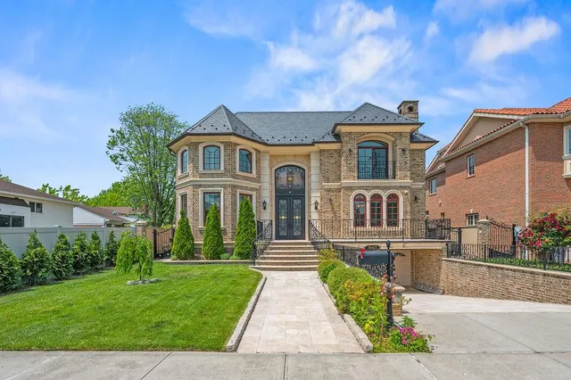 a front view of a house with a yard