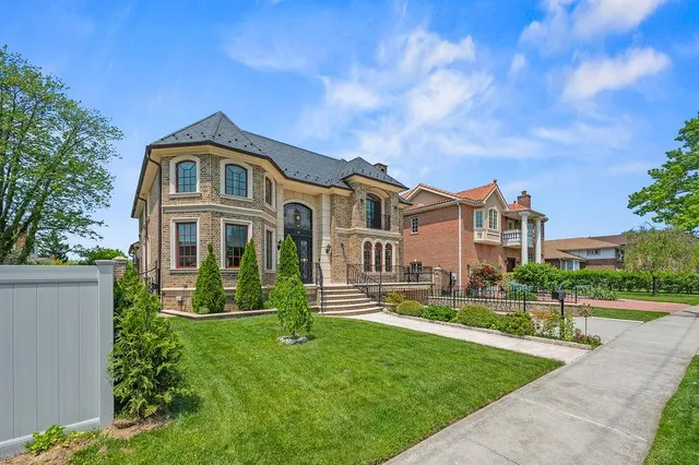 a aerial view of a house with a yard