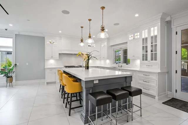 a kitchen with a table and chairs in it