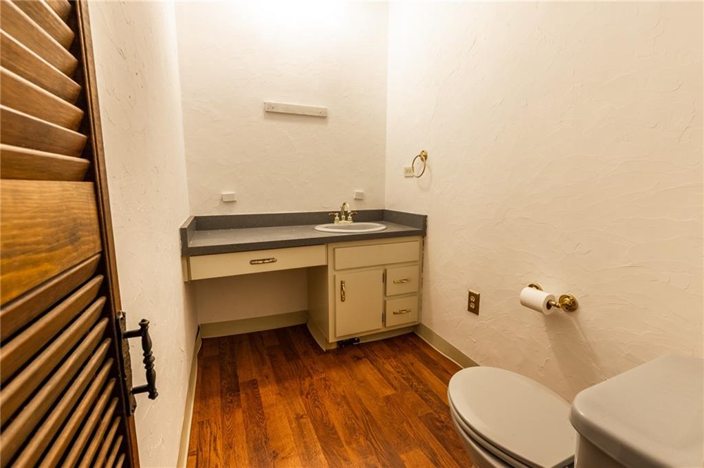 3260 Millers Run Road Cecil, PA 15321 - Photo 11 of 22 a bathroom with a granite countertop toilet sink and mirror