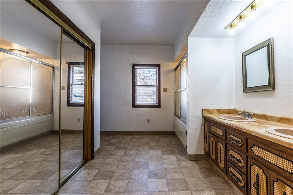 3260 Millers Run Road Cecil, PA 15321 - Photo 15 of 22 a bathroom with a sink a mirror and a shower