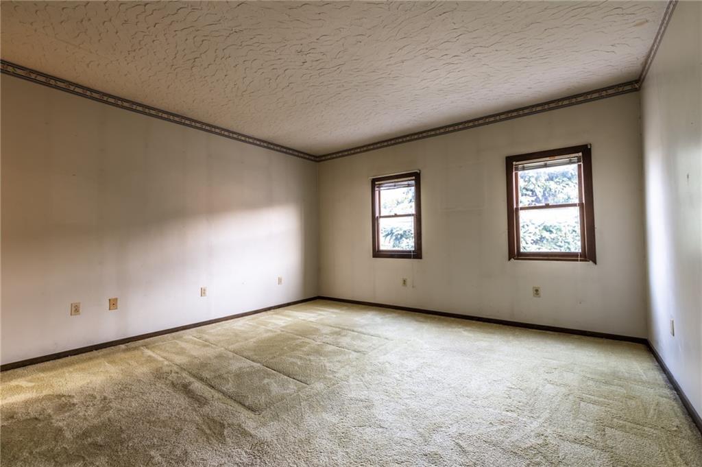 3260 Millers Run Road Cecil, PA 15321 - Photo 18 of 22 a view of an empty room with a window