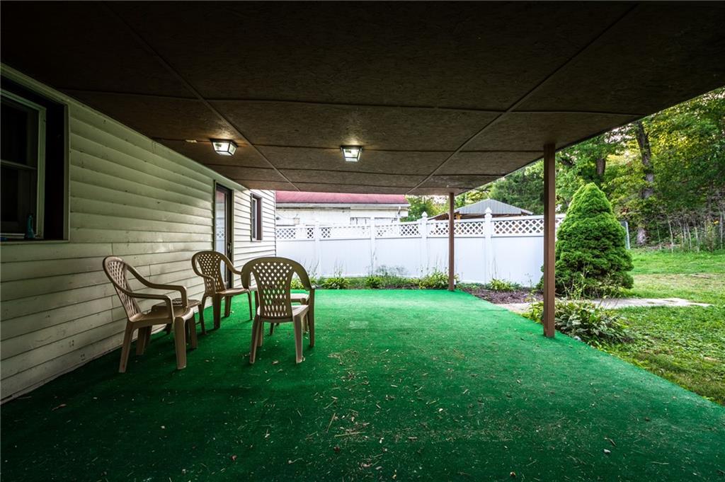 3260 Millers Run Road Cecil, PA 15321 - Photo 20 of 22 a backyard of a house with table and chairs