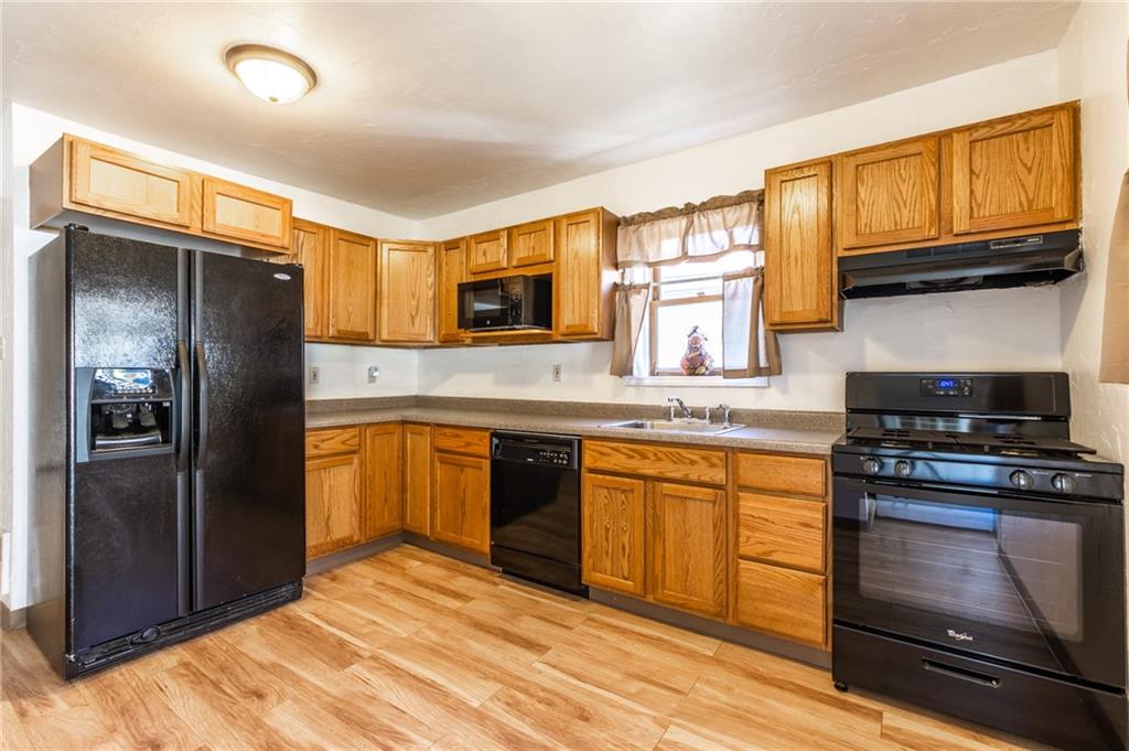 3260 Millers Run Road Cecil, PA 15321 - Photo 3 of 22 a kitchen with stainless steel appliances granite countertop a refrigerator stove top oven and sink