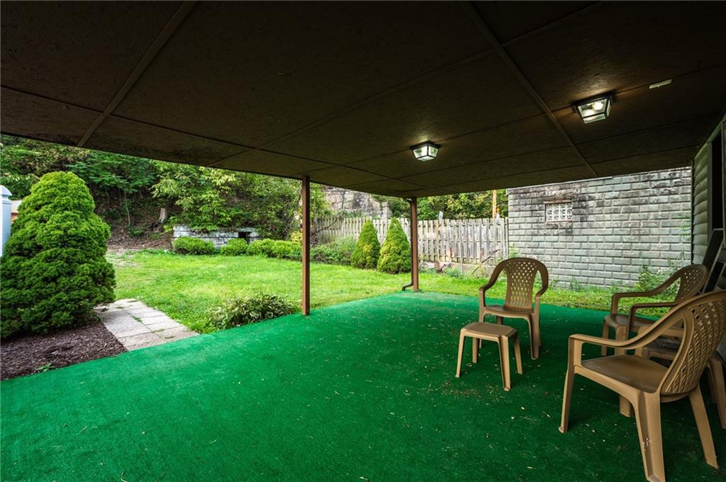 3260 Millers Run Road Cecil, PA 15321 - Photo 21 of 22 a backyard of a house with table and chairs