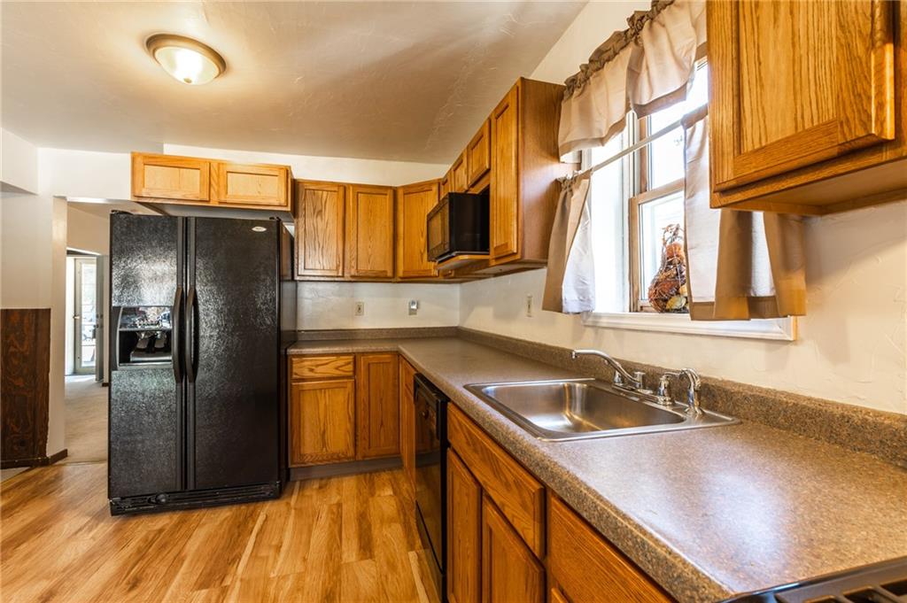3260 Millers Run Road Cecil, PA 15321 - Photo 5 of 22 a kitchen with stainless steel appliances granite countertop a sink and a refrigerator