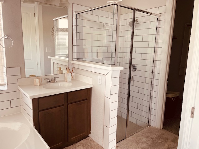 1925 Waterfall Avenue Leander, TX 78641 - Photo 11 of 17 a bathroom with a sink a vanity and a shower
