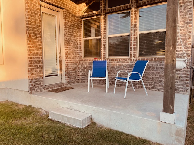 1925 Waterfall Avenue Leander, TX 78641 - Photo 16 of 17 a view of a patio with table and chairs and potted plants