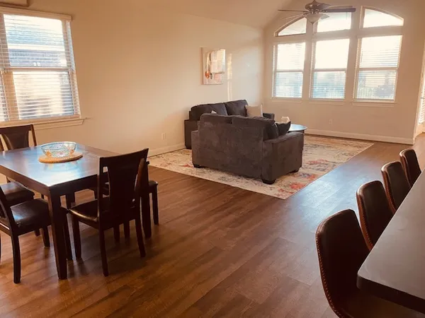 a living room with furniture and a window