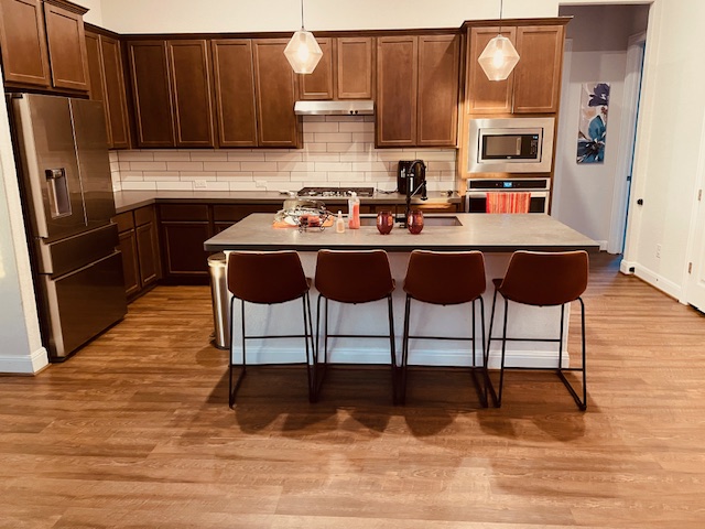 1925 Waterfall Avenue Leander, TX 78641 - Photo 6 of 17 a kitchen with a sink cabinets and appliances