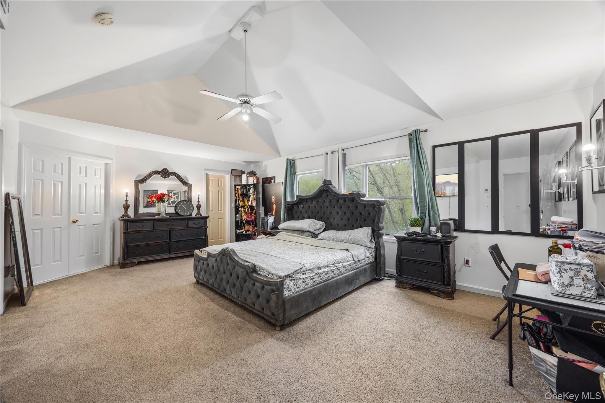 3 Miller Road Putnam Valley, NY 10579 - Photo 29 of 48 Vaulted ceiling featuring a ceiling fan, broad windows, and plush carpet flooring