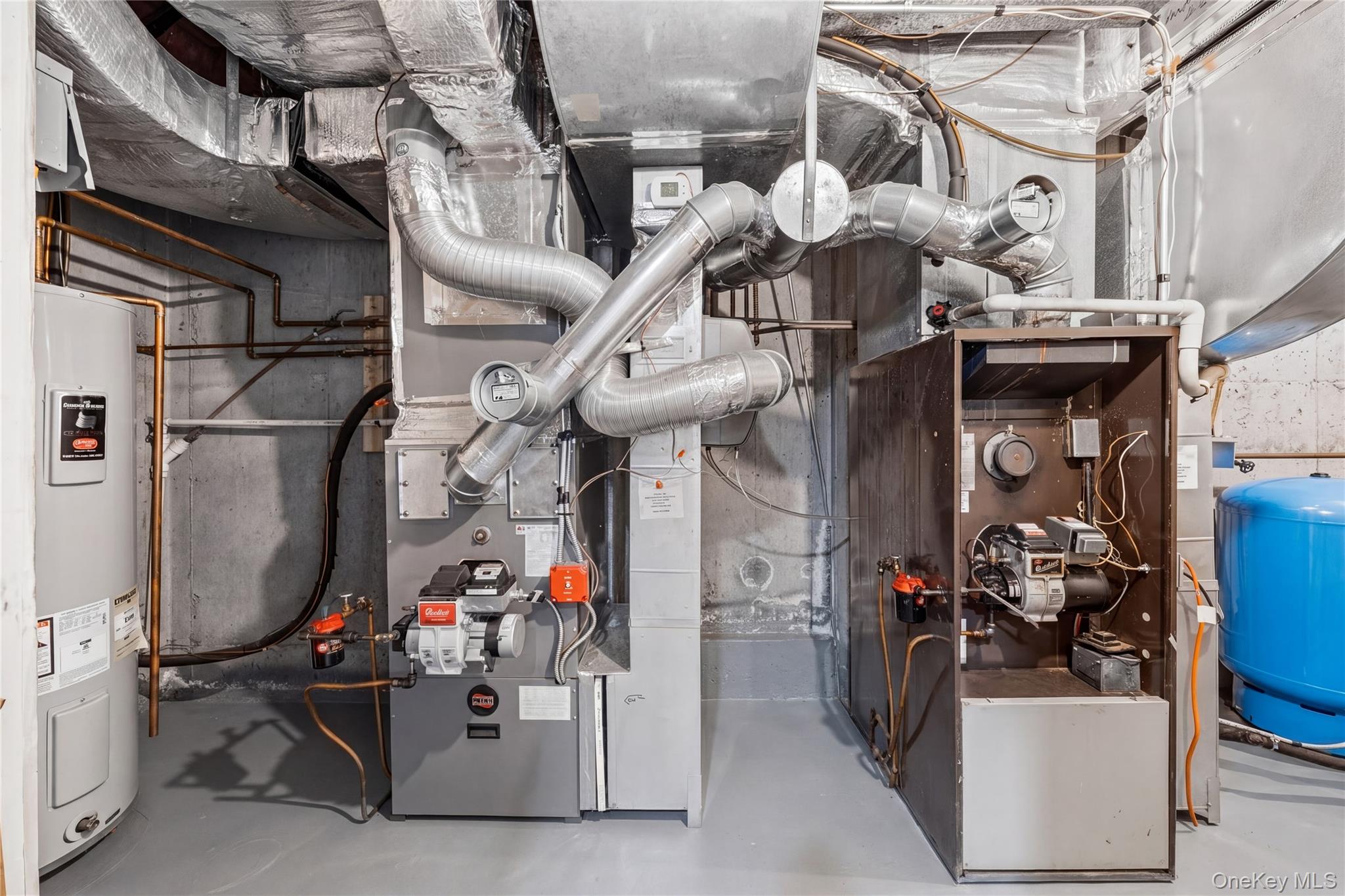 3 Miller Road Putnam Valley, NY 10579 - Photo 44 of 48 Dedicated mechanical room with two furnaces, a water heater, and an expansion tank
