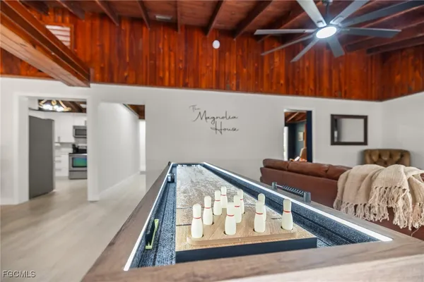 a view of living room with furniture and wooden floor