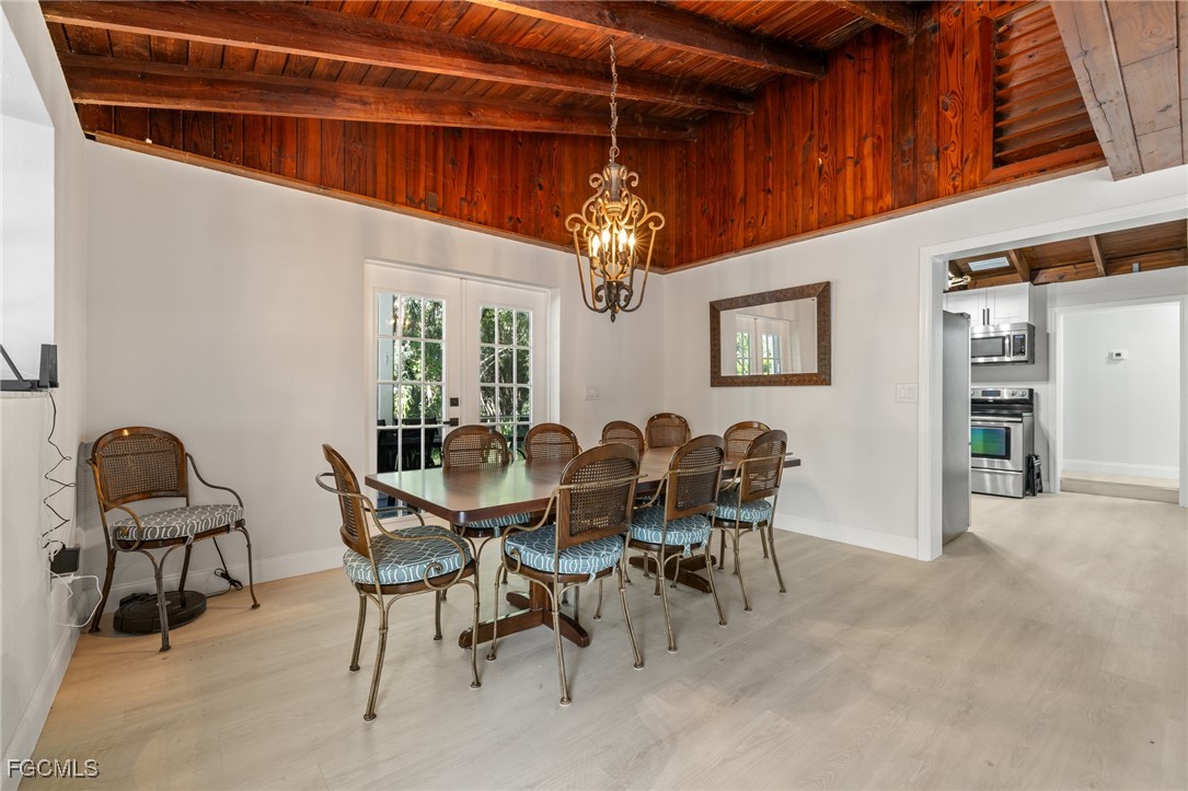 17780-800 Caloosa Road Alva, FL 33920 - Photo 20 of 42 a view of a dining room with furniture and chandelier