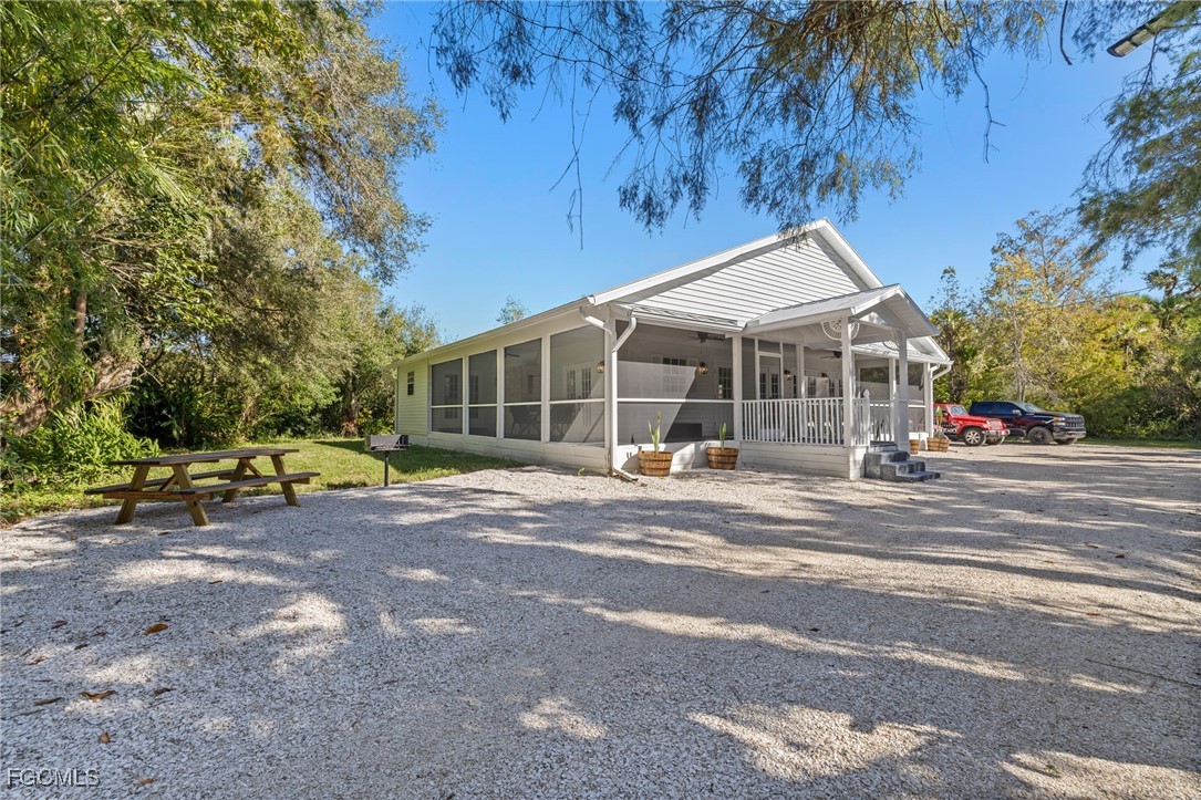 17780-800 Caloosa Road Alva, FL 33920 - Photo 2 of 42 a view of a house with a patio