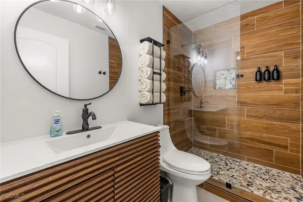 a kitchen with a refrigerator sink and cabinets