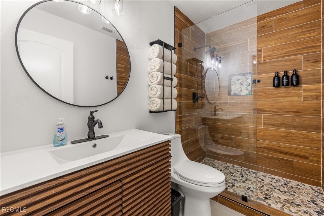 17780-800 Caloosa Road Alva, FL 33920 - Photo 34 of 42 a bathroom with a sink a toilet and shower