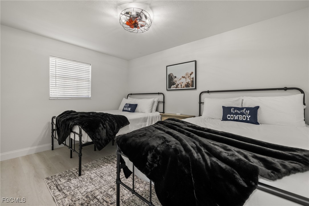 17780-800 Caloosa Road Alva, FL 33920 - Photo 37 of 42 a bedroom with two beds and a desk