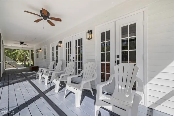 a view of living room kitchen with furniture and wooden floor