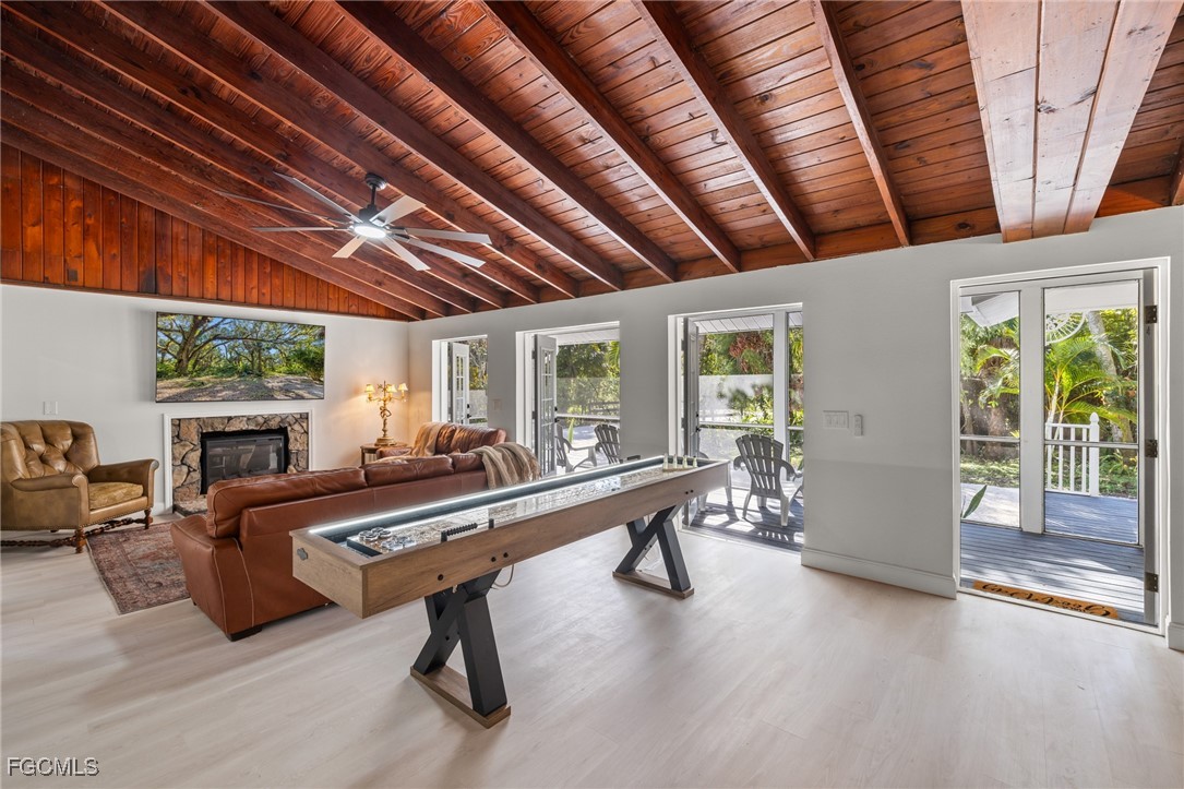 17780-800 Caloosa Road Alva, FL 33920 - Photo 10 of 42 a room with furniture pool table gym equipment and windows