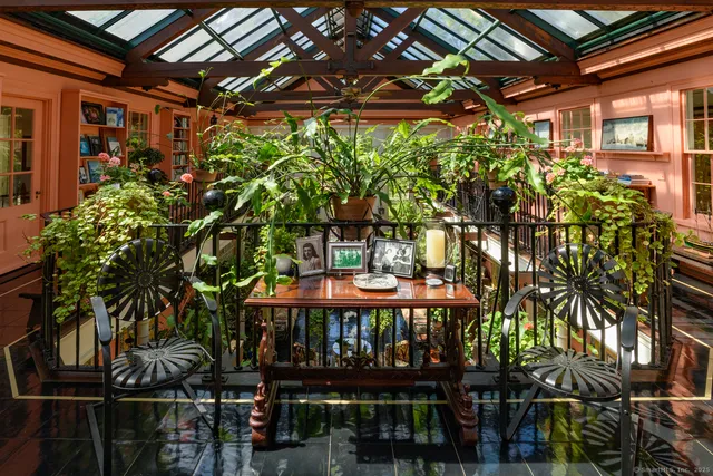 a view of a chairs and table in the room