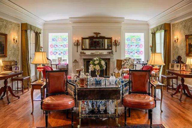 a living room with fireplace furniture and a flat screen tv