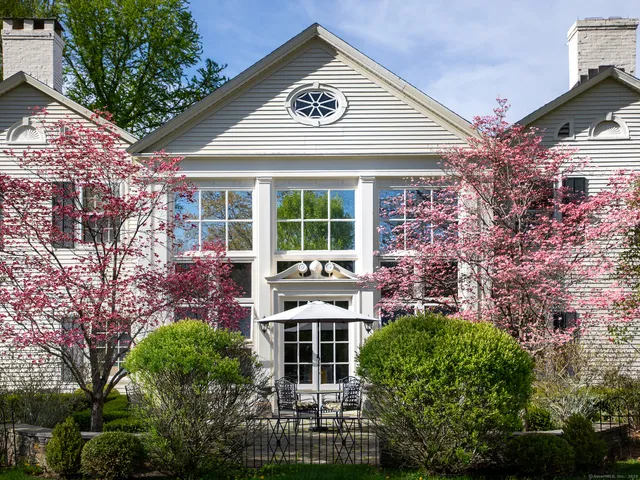 front view of a building with a garden