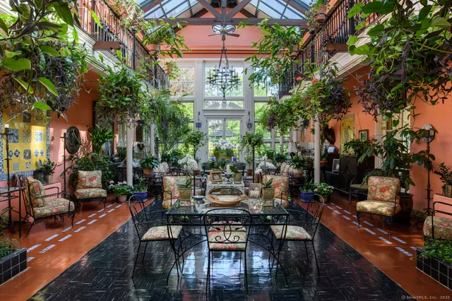 a view of a chairs and table in a patio