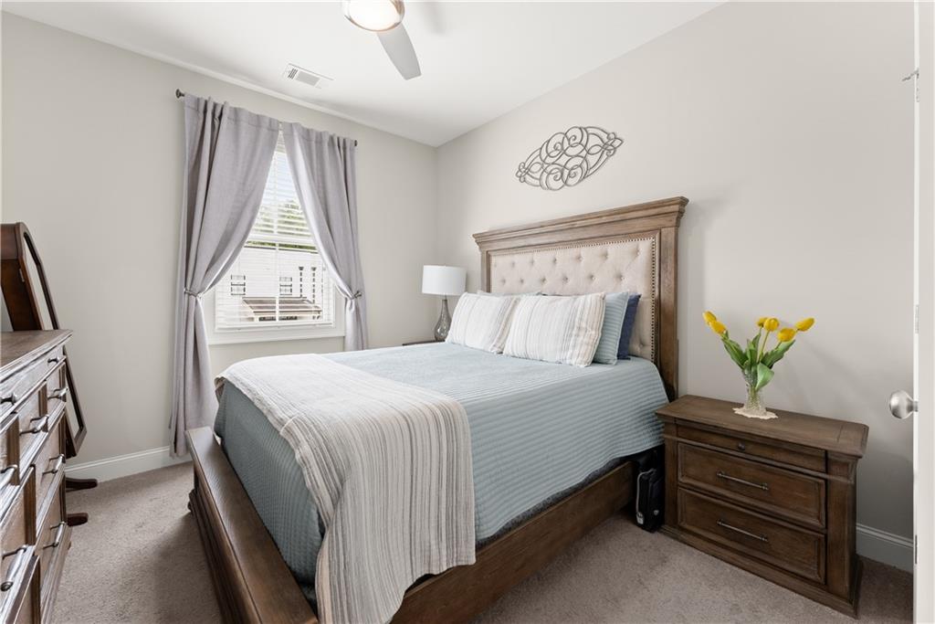 3206 Ridge Towne Place Duluth, GA 30096 - Photo 25 of 42 a bedroom with a bed and a window