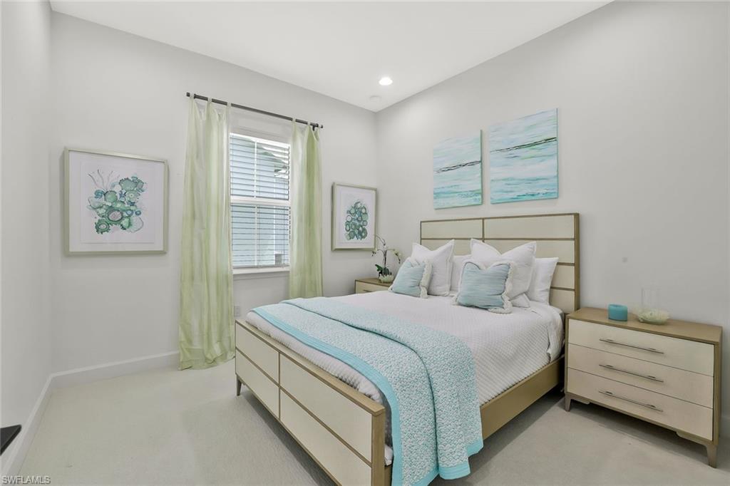 7295 Cayo Coco Lane Naples, FL 34113 - Photo 14 of 16 a bedroom with a bed and a window