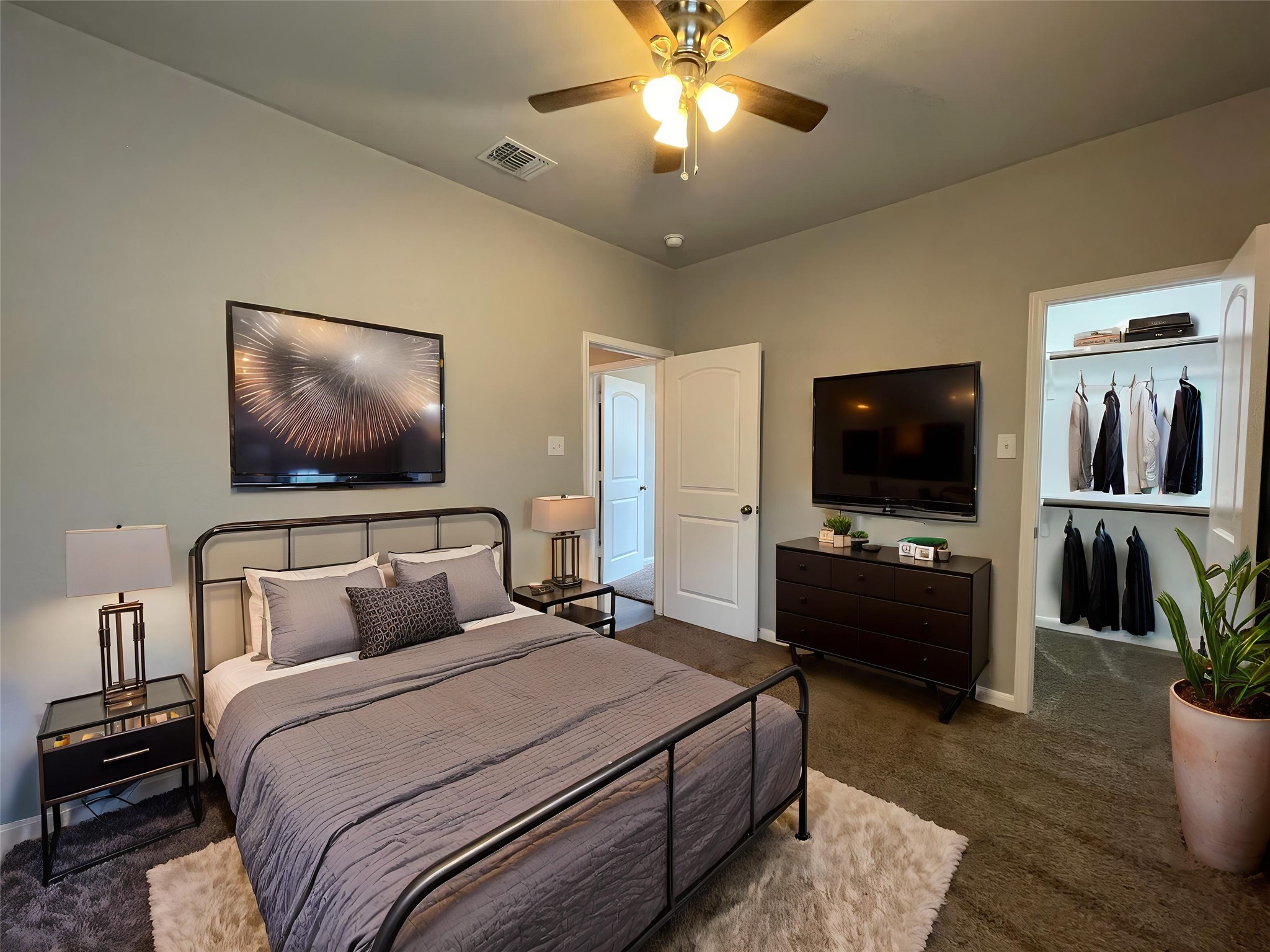 8113 Northgate Loop Temple, TX 76502 - Photo 21 of 35 Carpeted bedroom featuring a vaulted ceiling with a ceiling fan, a built-in closet with shelving and hanging rods, and an interior door