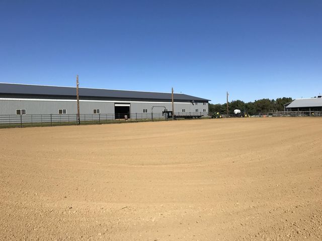 a front view of a house with large windows