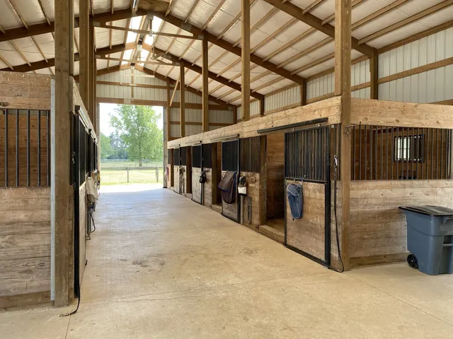 a front view of a house with a yard table and chairs