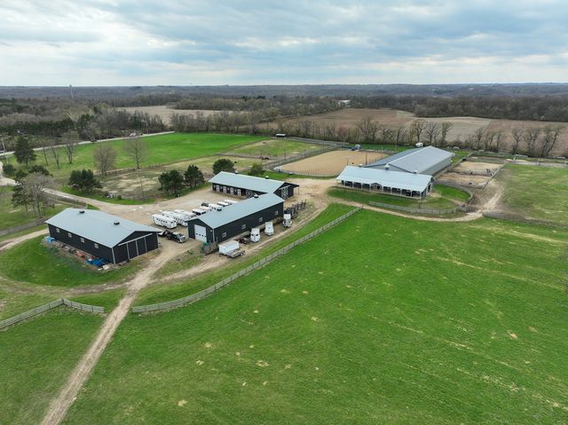 an aerial view of a house with garden space and street view