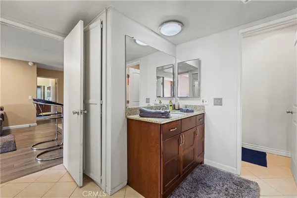 a bathroom with a double vanity sink and a mirror