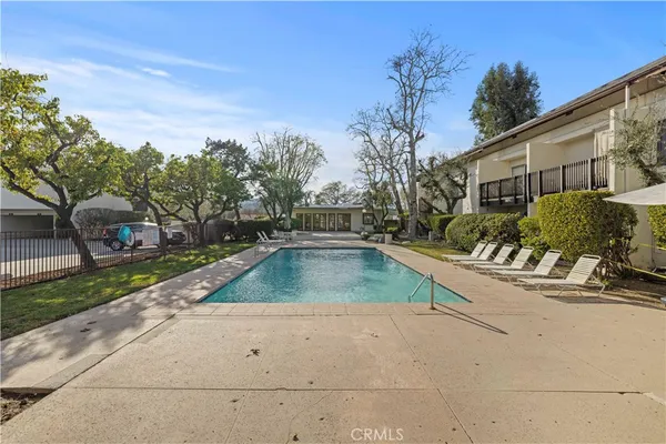 an aerial view of a house with a yard and plants