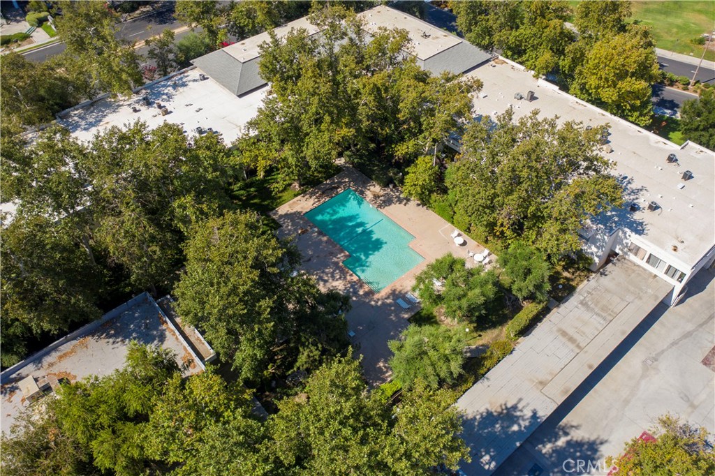 23515 Lyons Avenue, Unit 277 Valencia, CA 91355 - Photo 25 of 29 an aerial view of a house with a yard and garden